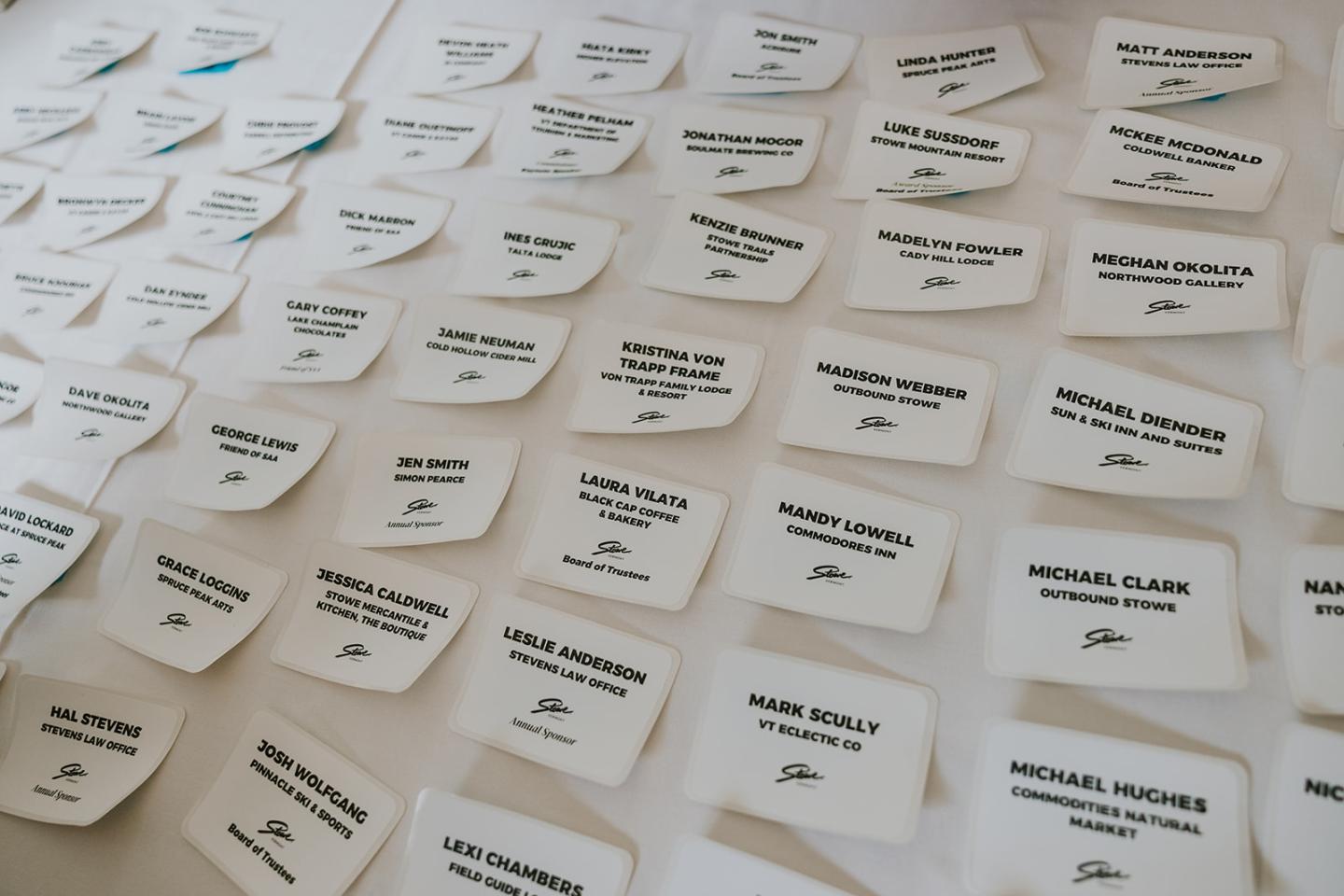 Name tags arranged on a table.